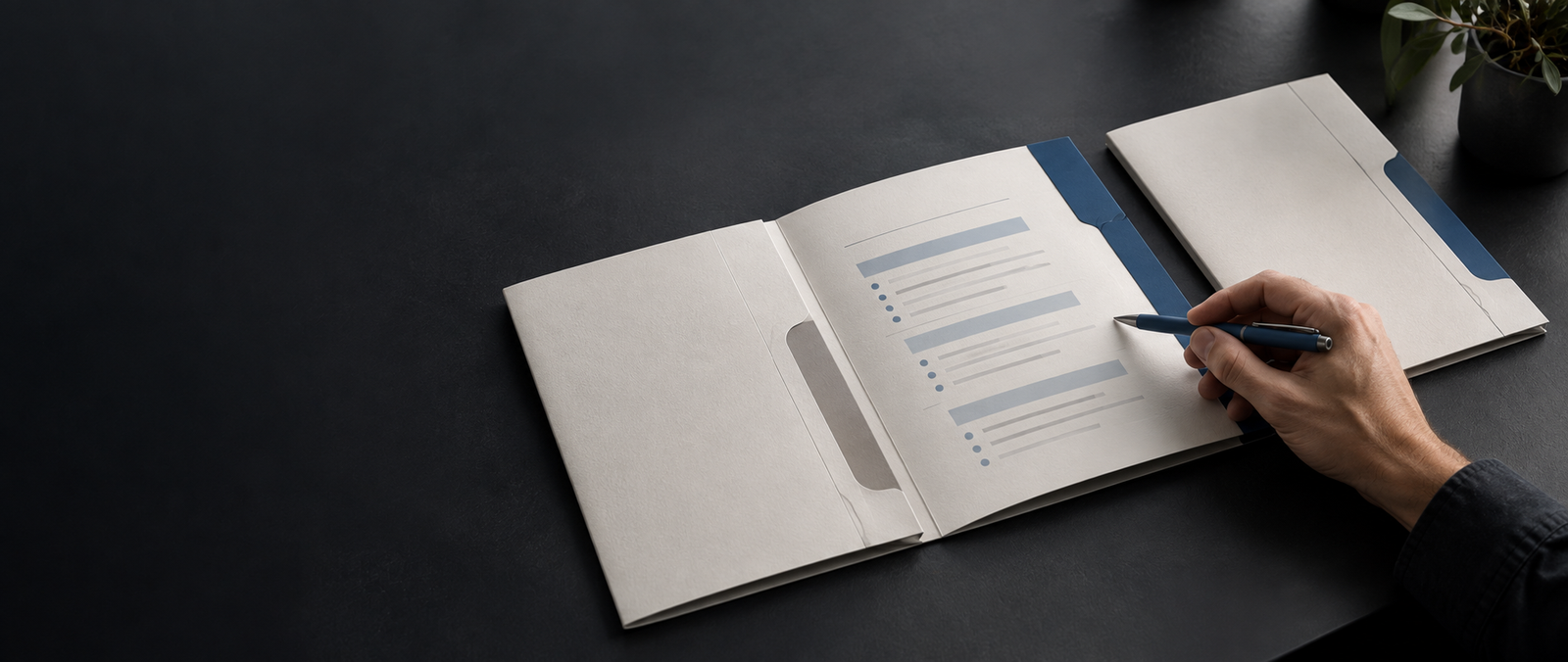 A hand reviewing the scope inside a proposal folder. Alt text: “Strategist reviewing a proposal scope in an open folder.